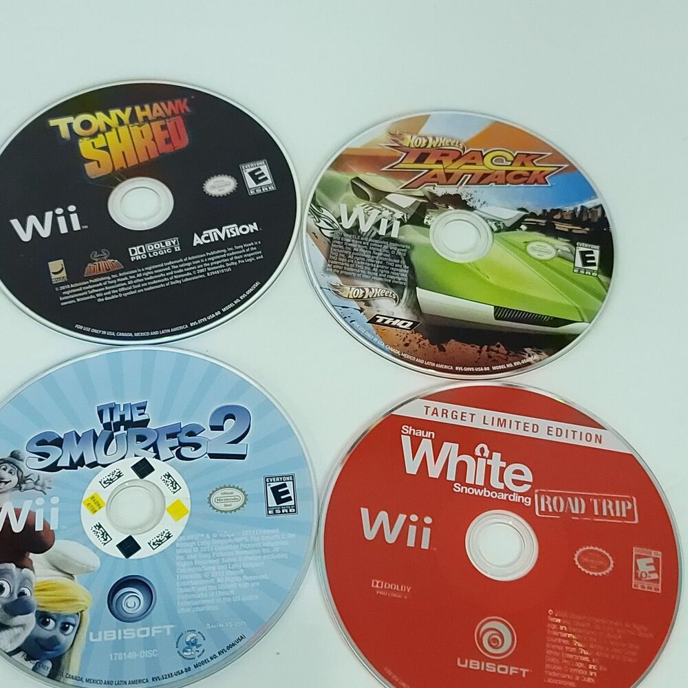 Nintendo Wii Games Lot of 4 Bundle Track Attack Tony Hawk Shaun White Smurfs 2